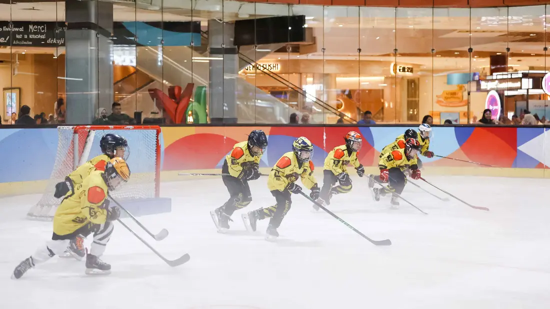 Golden Cobras players skating in a drill at BX Rink