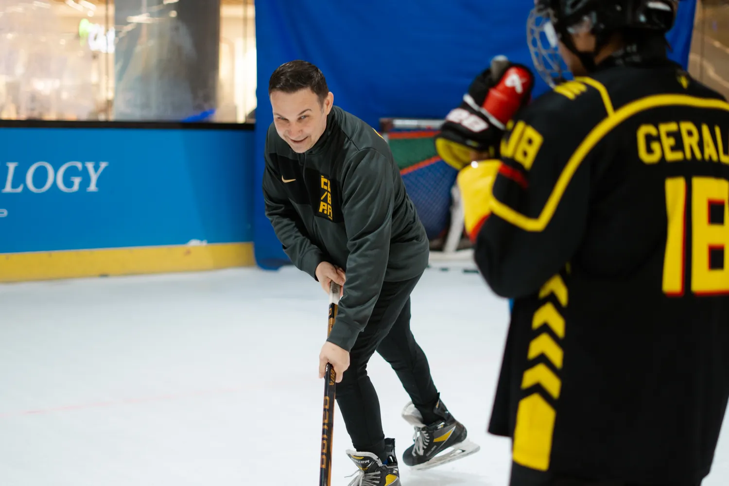A coach and player working together at practice